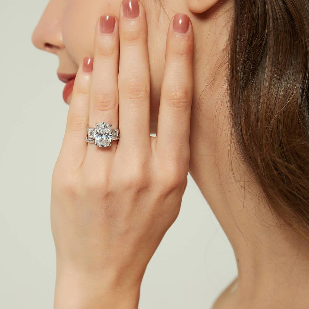 Model wearing 3-Stone Oval CZ Ring Set in Sterling Silver