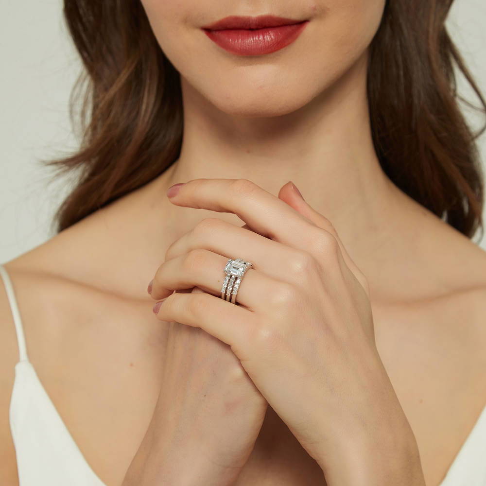 Model wearing Solitaire Art Deco 2.1ct Emerald Cut CZ Ring Set in Sterling Silver