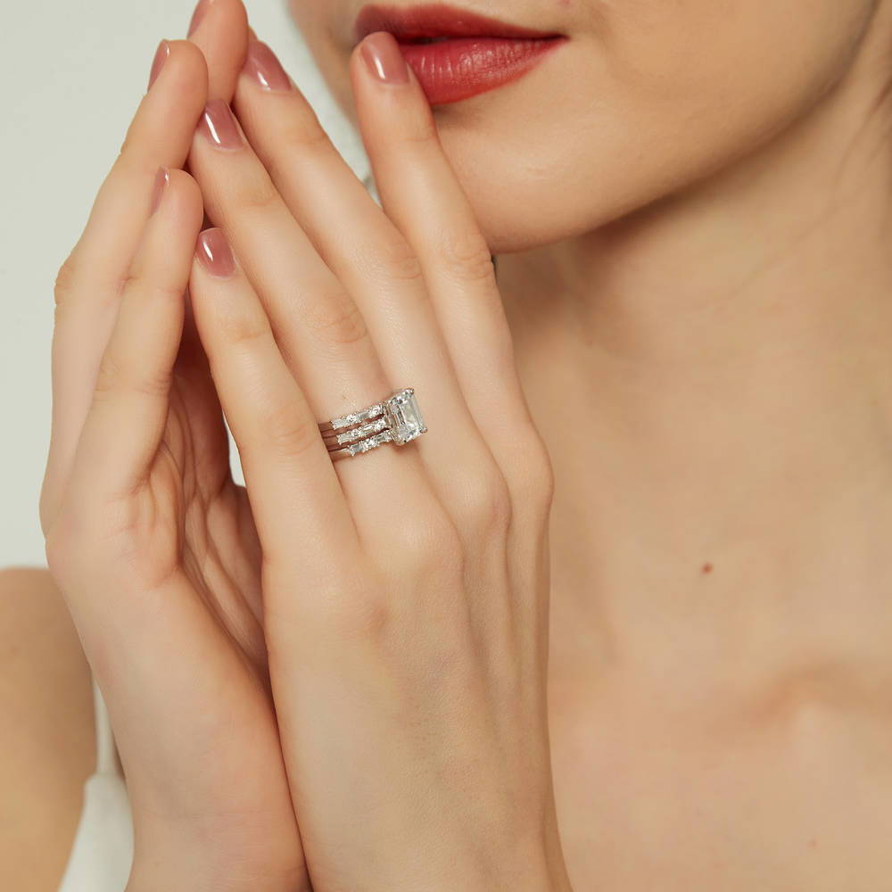 Model wearing Solitaire Art Deco 2.1ct Emerald Cut CZ Ring Set in Sterling Silver