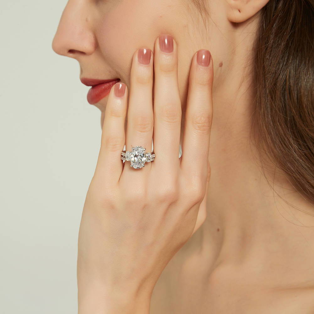 Model wearing 3-Stone Oval CZ Ring Set in Sterling Silver