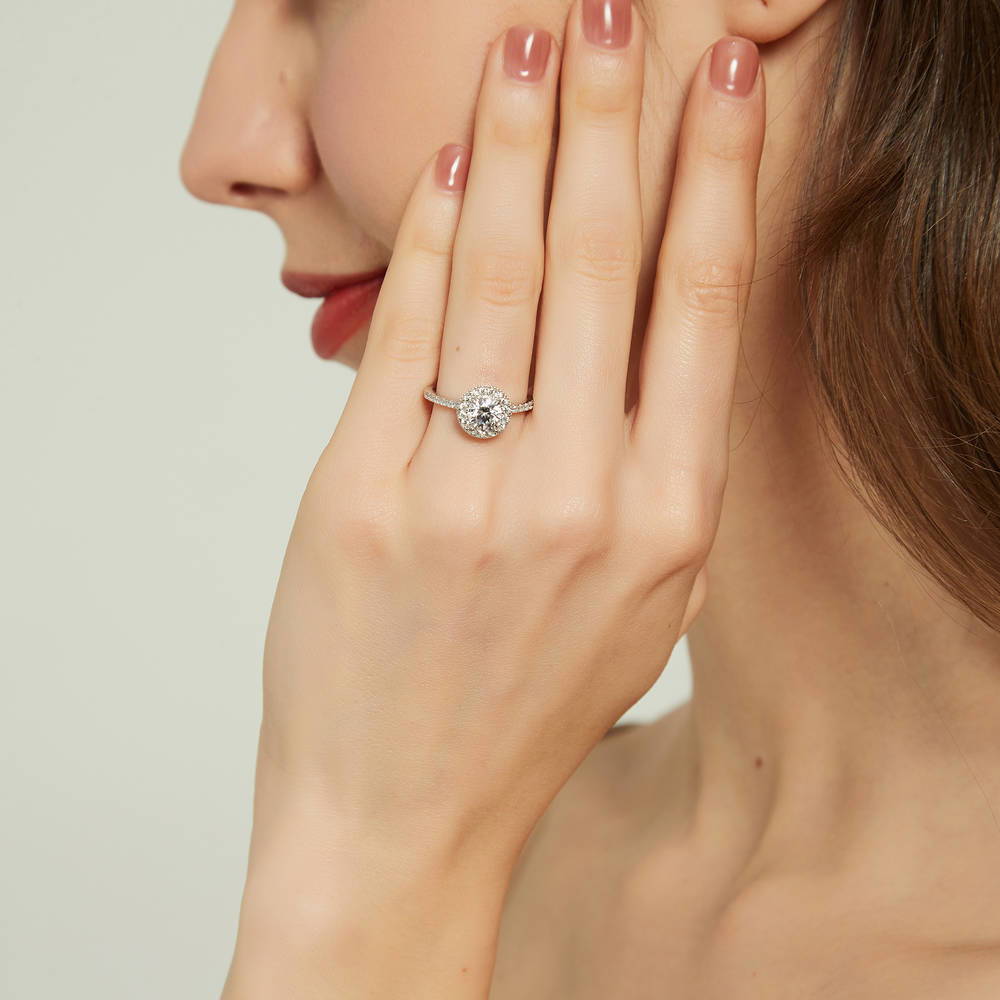 Model wearing Halo Round CZ Ring in Sterling Silver