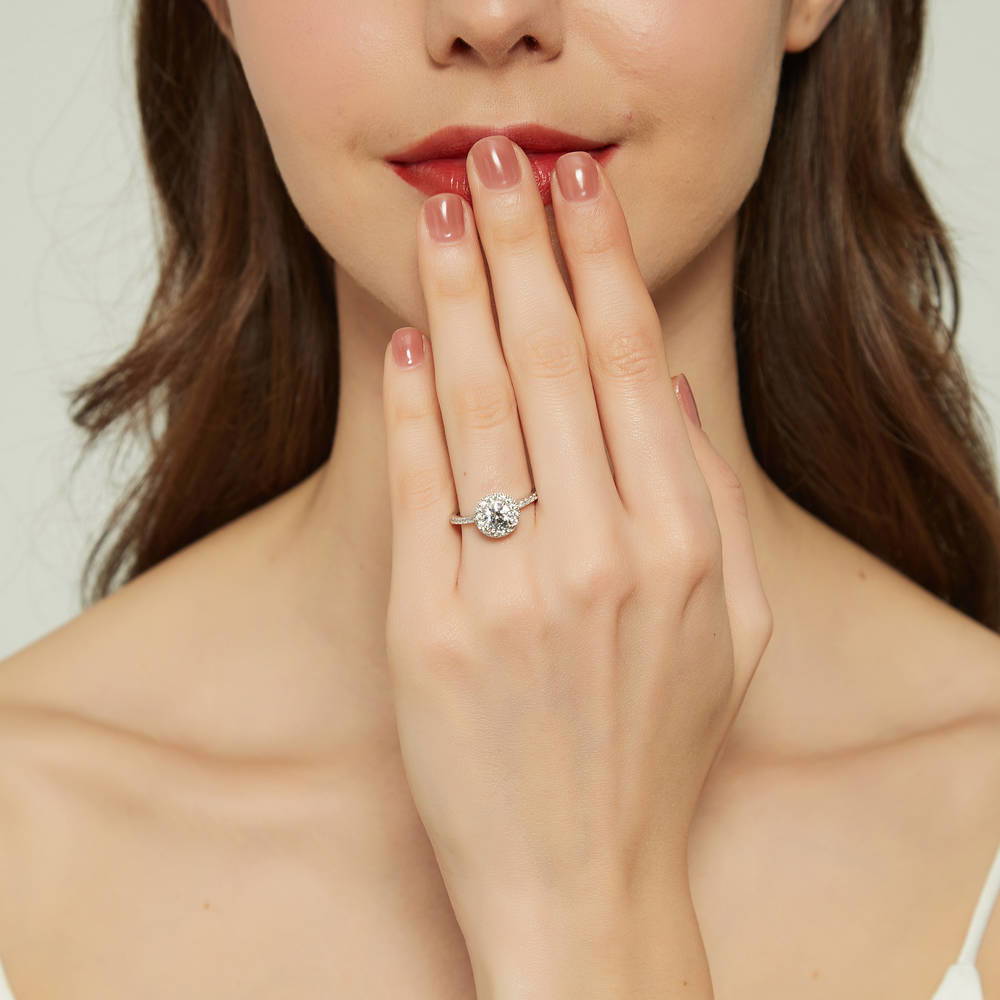 Model wearing Halo Round CZ Ring in Sterling Silver