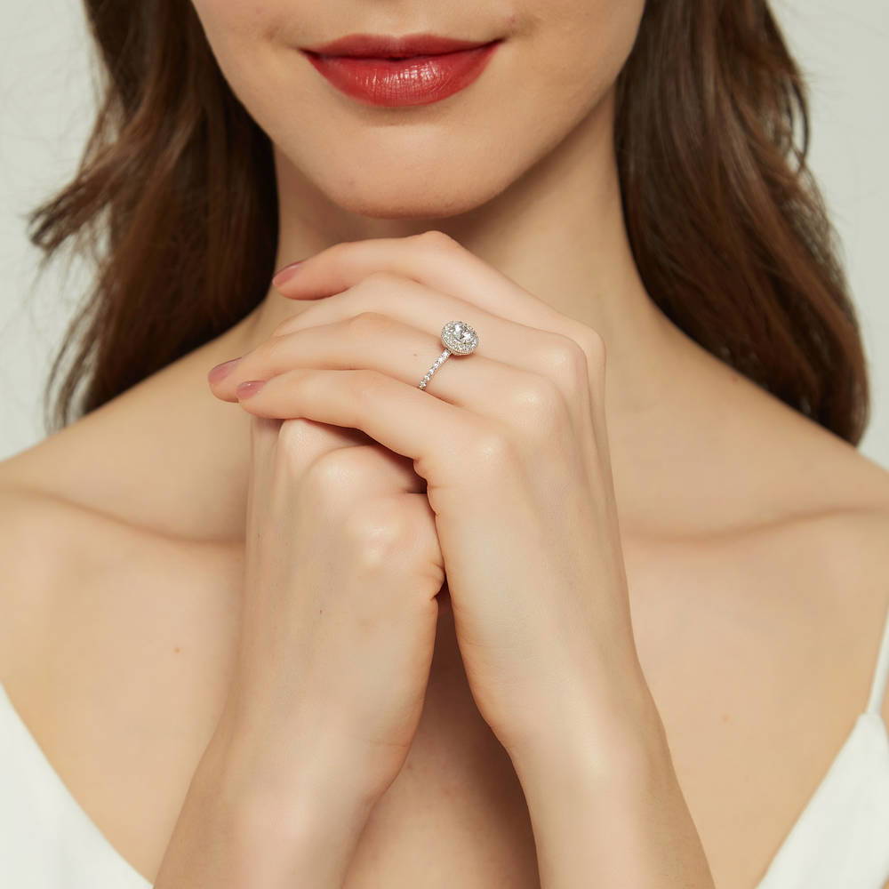 Model wearing Halo Round CZ Ring in Sterling Silver