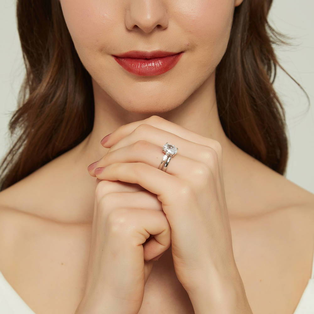 Model wearing 3-Stone Oval CZ Ring Set in Sterling Silver