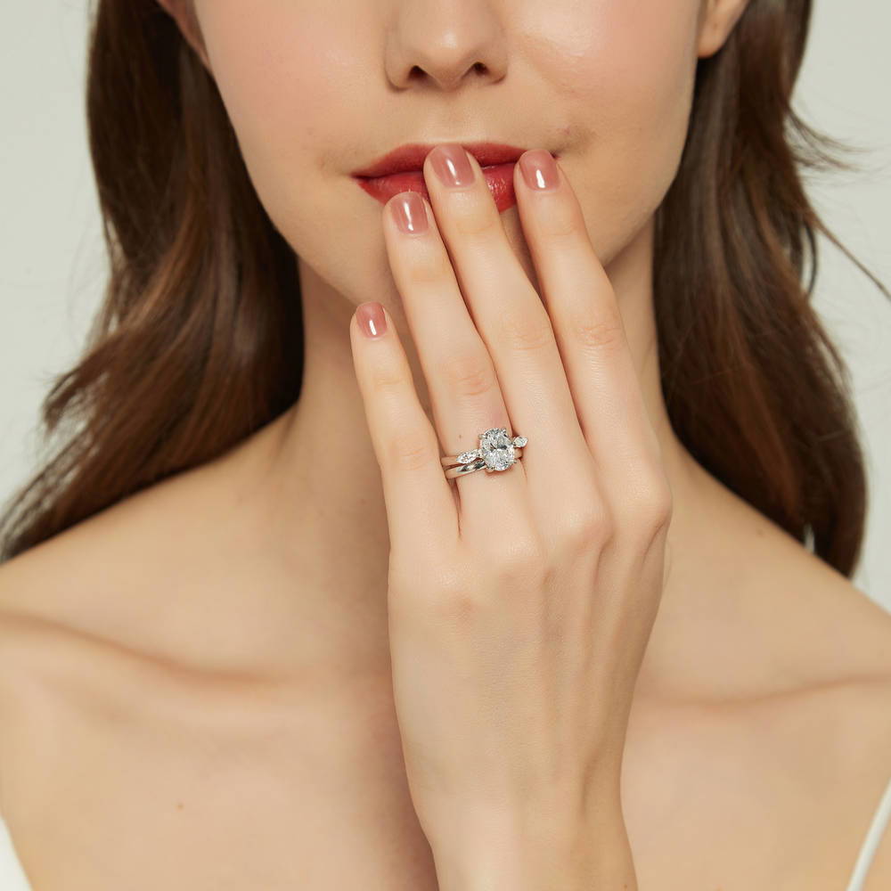 Model wearing 3-Stone Oval CZ Ring Set in Sterling Silver