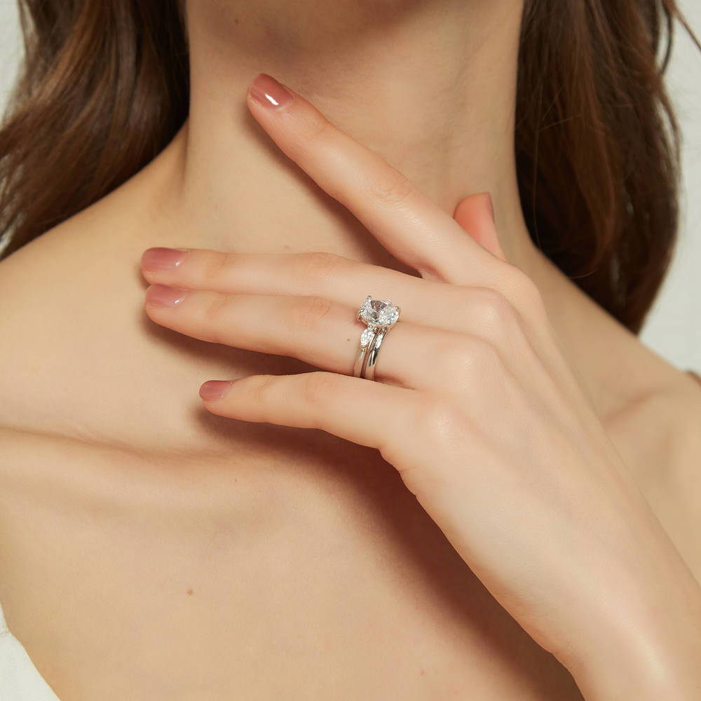 Model wearing 3-Stone Oval CZ Ring Set in Sterling Silver