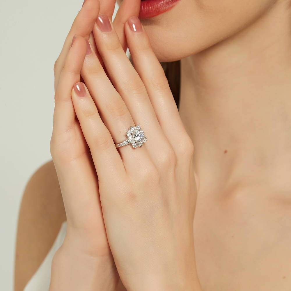 Model wearing Flower Halo CZ Ring in Sterling Silver