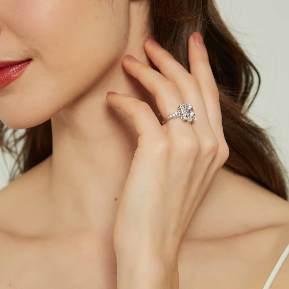 Model wearing Flower Halo CZ Ring in Sterling Silver