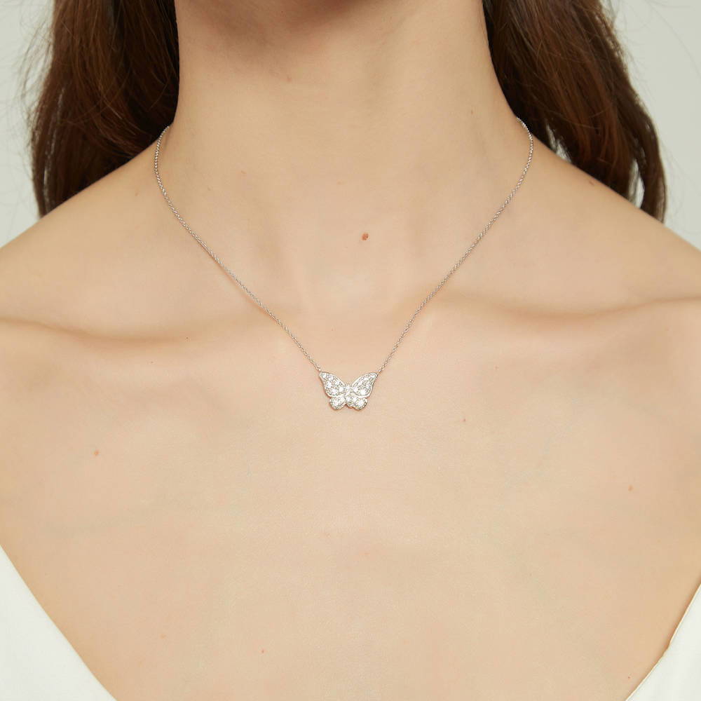 Model wearing Butterfly CZ Pendant Necklace in Sterling Silver