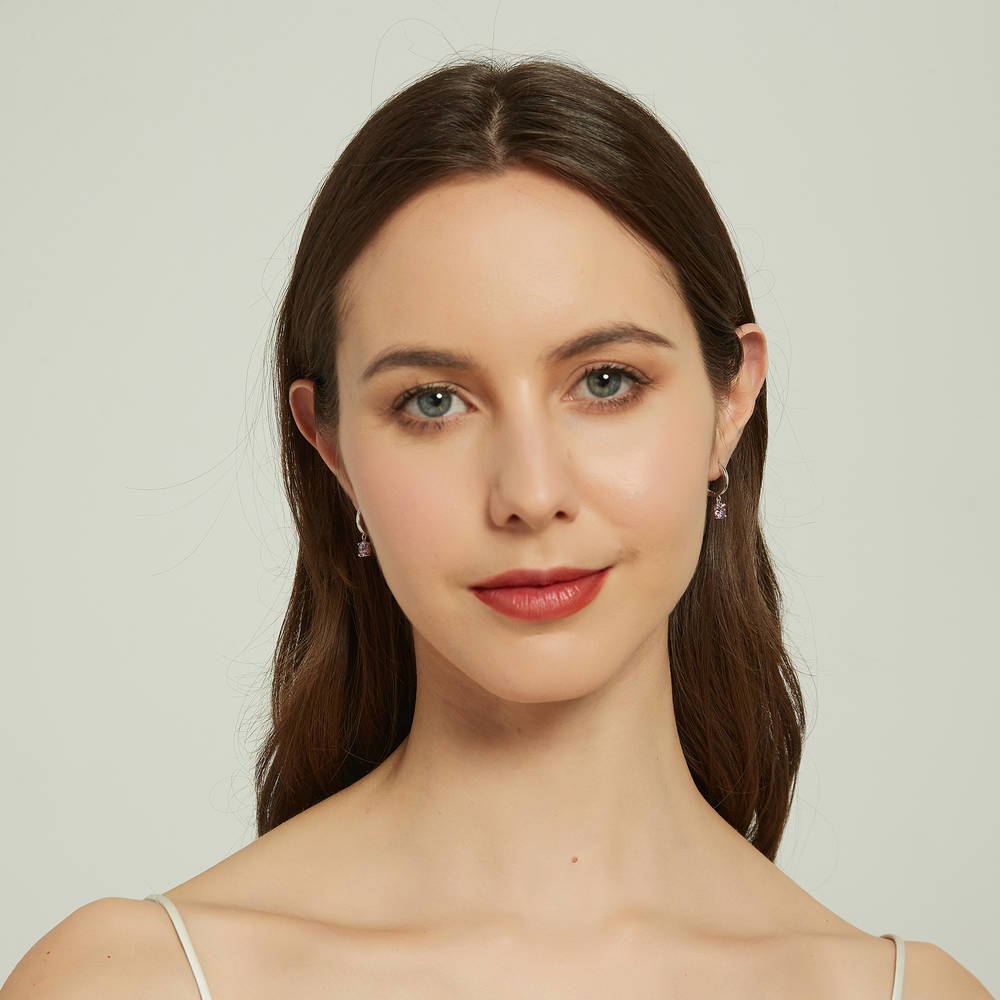 Model wearing Solitaire Round CZ Dangle Earrings in Sterling Silver 1.6ct