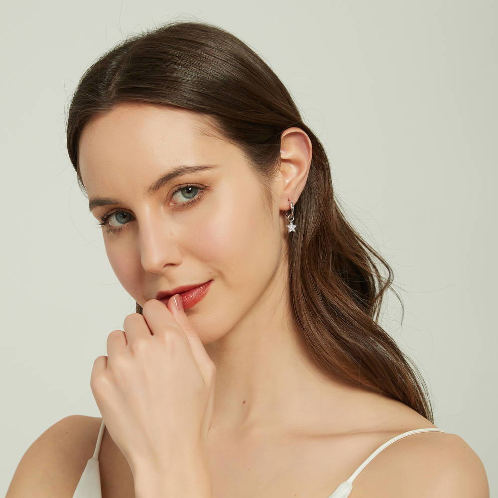 Model wearing Star CZ Dangle Earrings in Sterling Silver