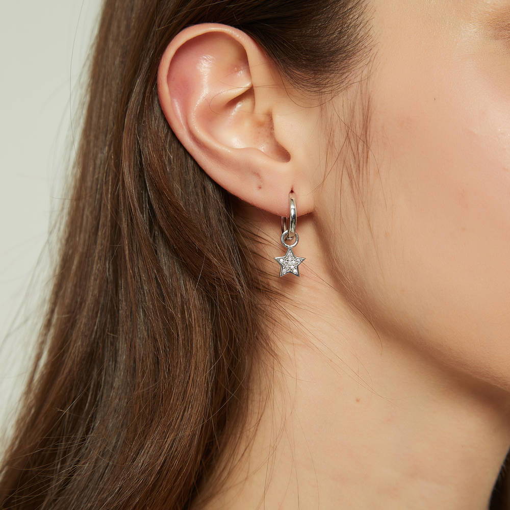 Model wearing Star CZ Dangle Earrings in Sterling Silver