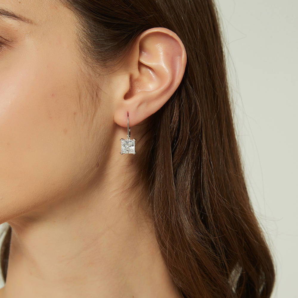 Model wearing Solitaire 6ct Princess CZ Leverback Dangle Earrings in Sterling Silver