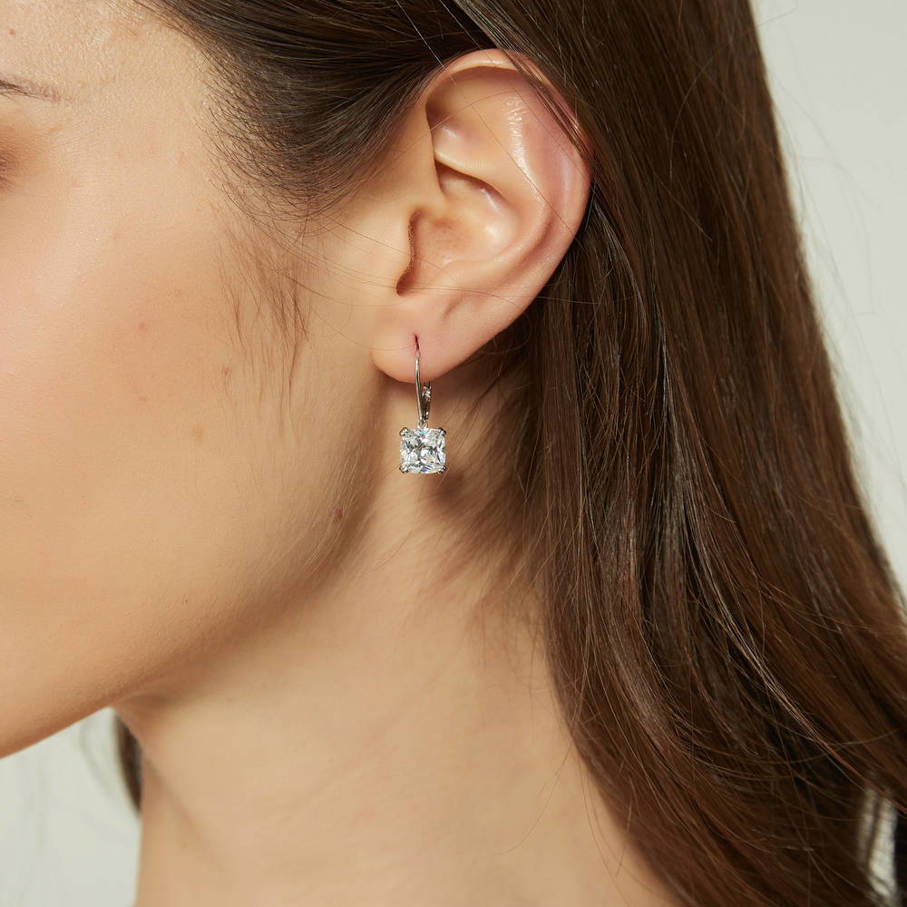 Model wearing Solitaire 6ct Cushion CZ Leverback Dangle Earrings in Sterling Silver