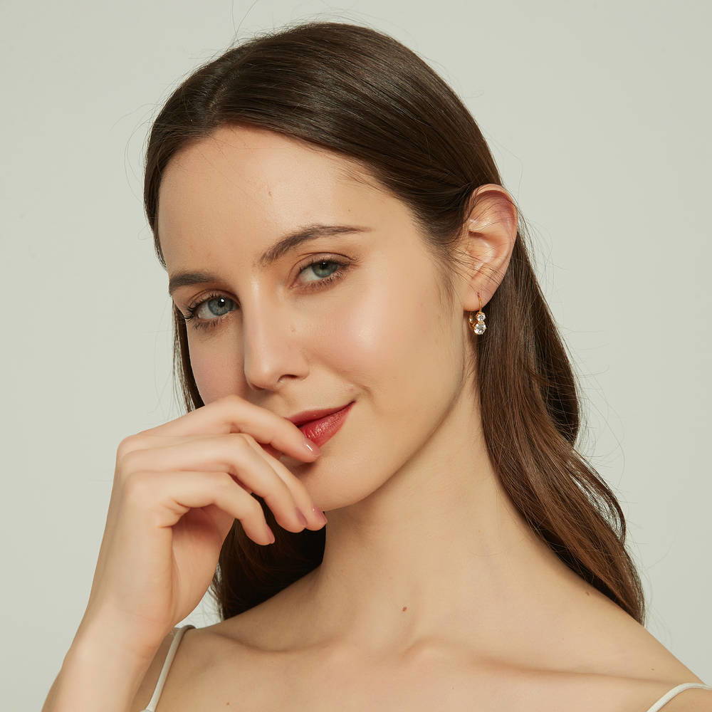 Model wearing CZ Leverback Dangle Earrings in Sterling Silver