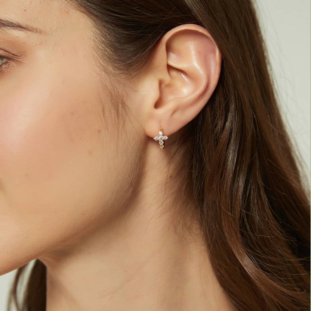 Model wearing Cross CZ Mini Huggie Earrings in Sterling Silver 0.5 inch, Gold Flashed