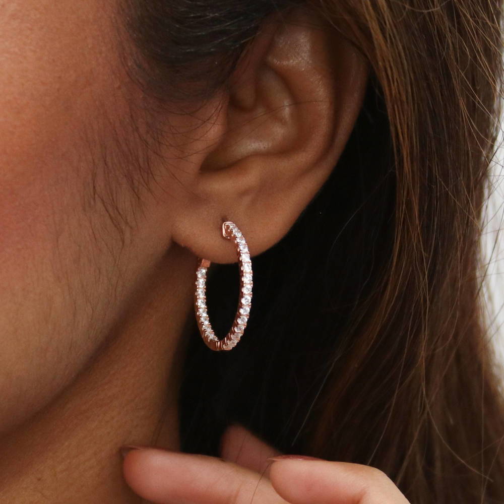 Model wearing CZ Small Inside-Out Hoop Earrings in Sterling Silver 1 inch, Rose Gold Flashed