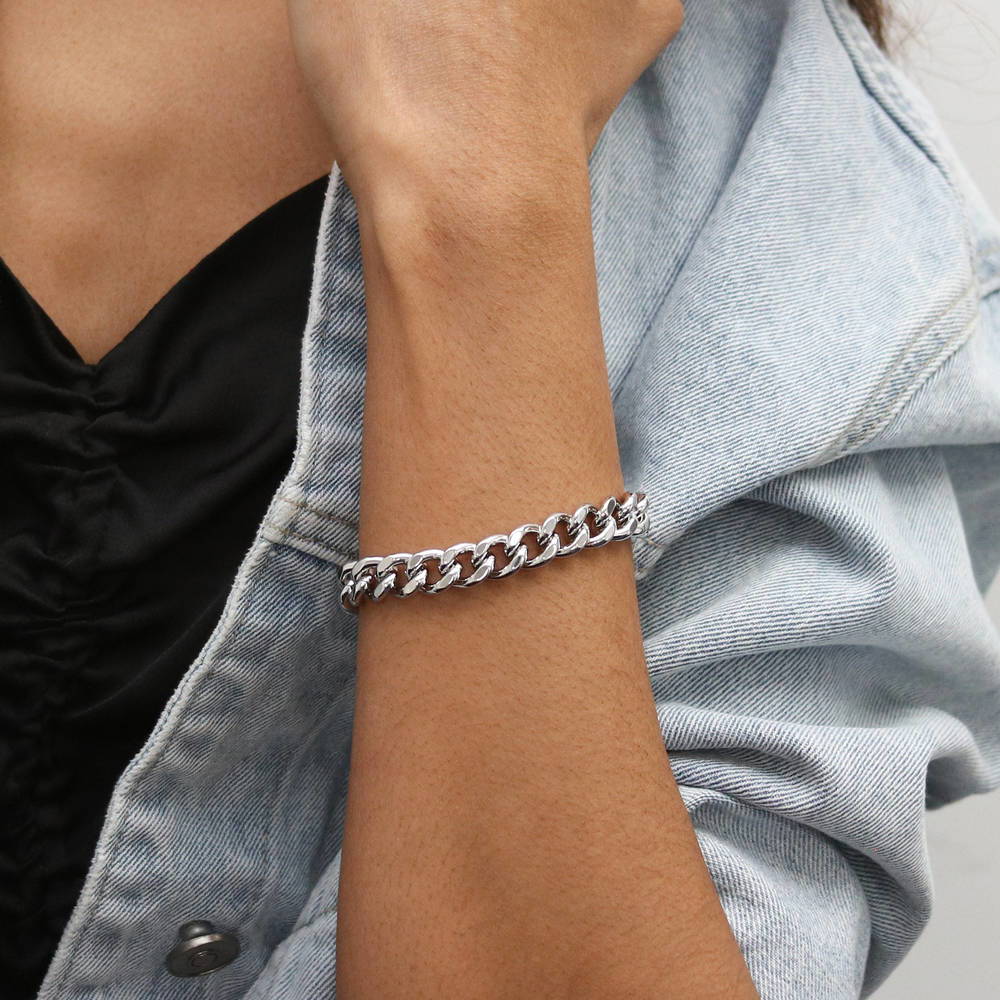 Model wearing Statement Lightweight Curb Chain Bracelet in Silver-Tone 9mm