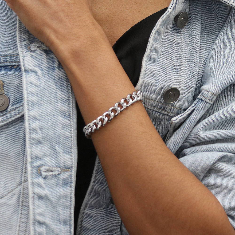 Model wearing Statement Lightweight Curb Chain Bracelet in Silver-Tone 9mm