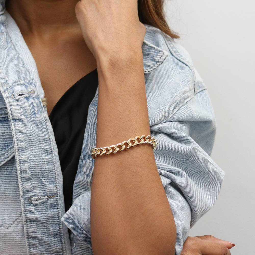 Model wearing Statement Lightweight Curb Chain Bracelet in Gold-Tone 9mm