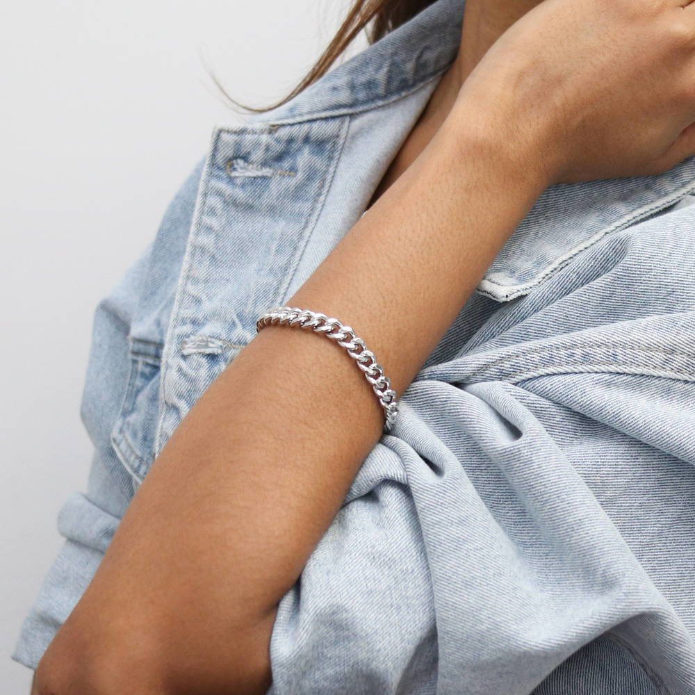 Model wearing Statement Lightweight Curb Chain Bracelet in Silver-Tone 7mm