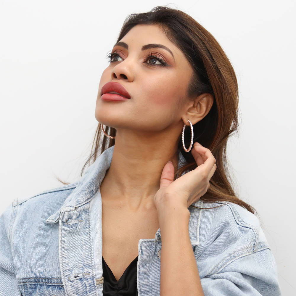 Model wearing CZ Inside-Out Hoop Earrings in Sterling Silver 1.8 inch, Rose Gold Flashed