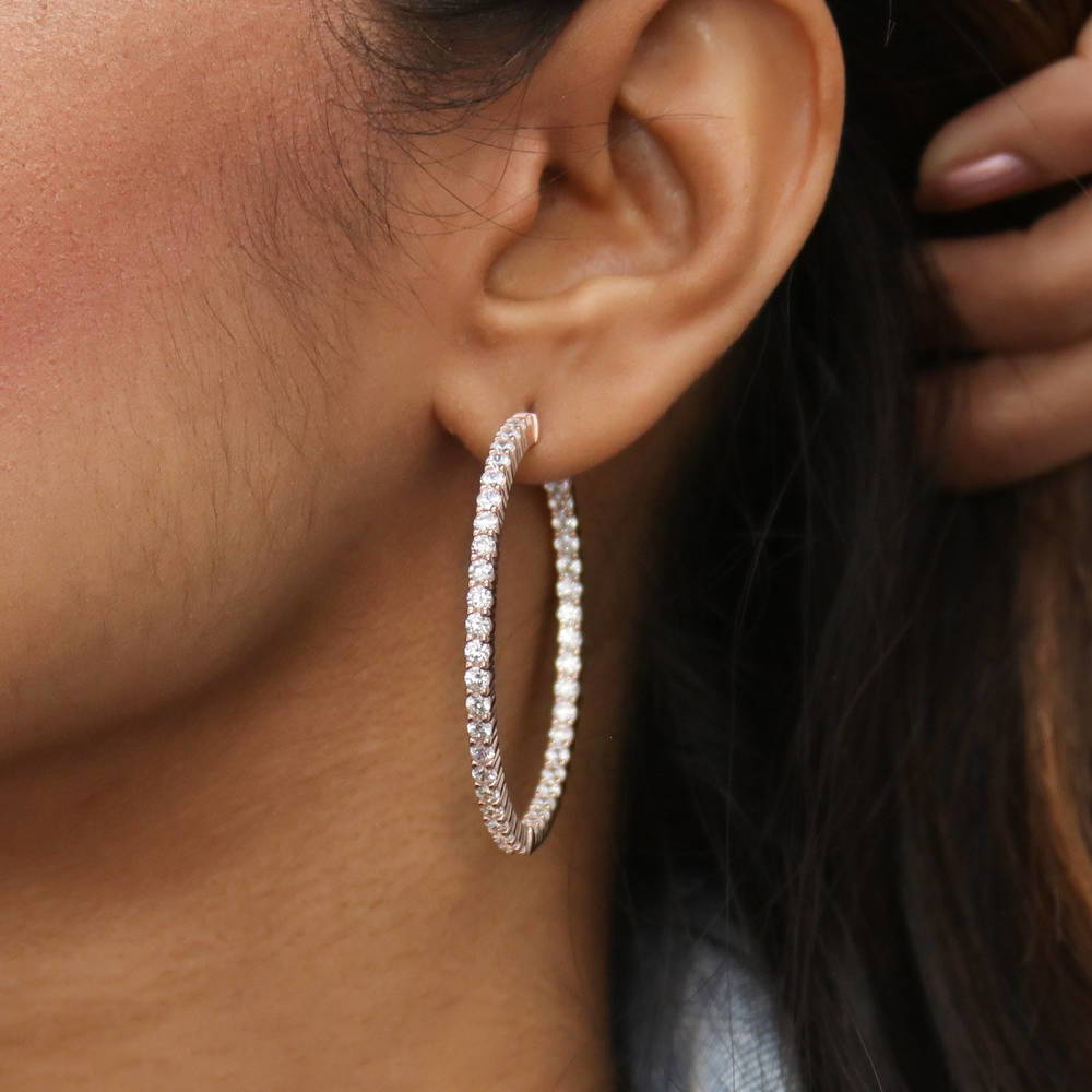 Model wearing CZ Large Inside-Out Hoop Earrings in Sterling Silver 1.8 inch