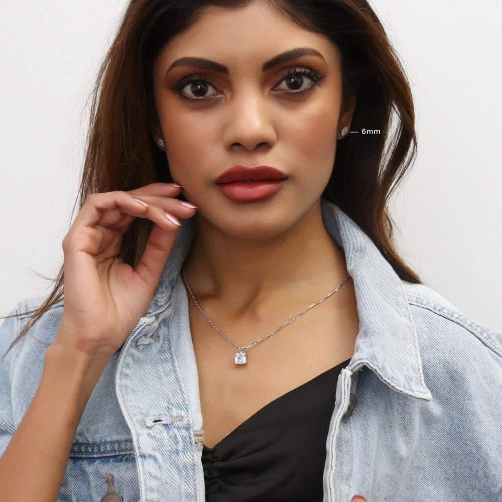 Model wearing Solitaire Asscher CZ Necklace and Earrings Set in Sterling Silver