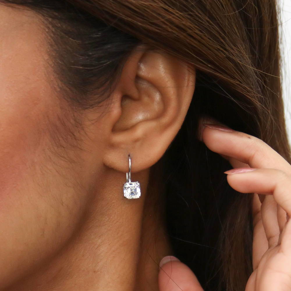 Model wearing Solitaire 3.2ct Asscher CZ Fish Hook Dangle Earrings in Sterling Silver