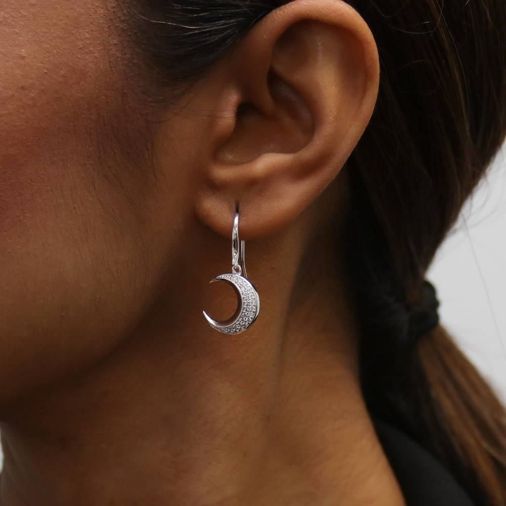 Model wearing Crescent Moon CZ Fish Hook Dangle Earrings in Sterling Silver