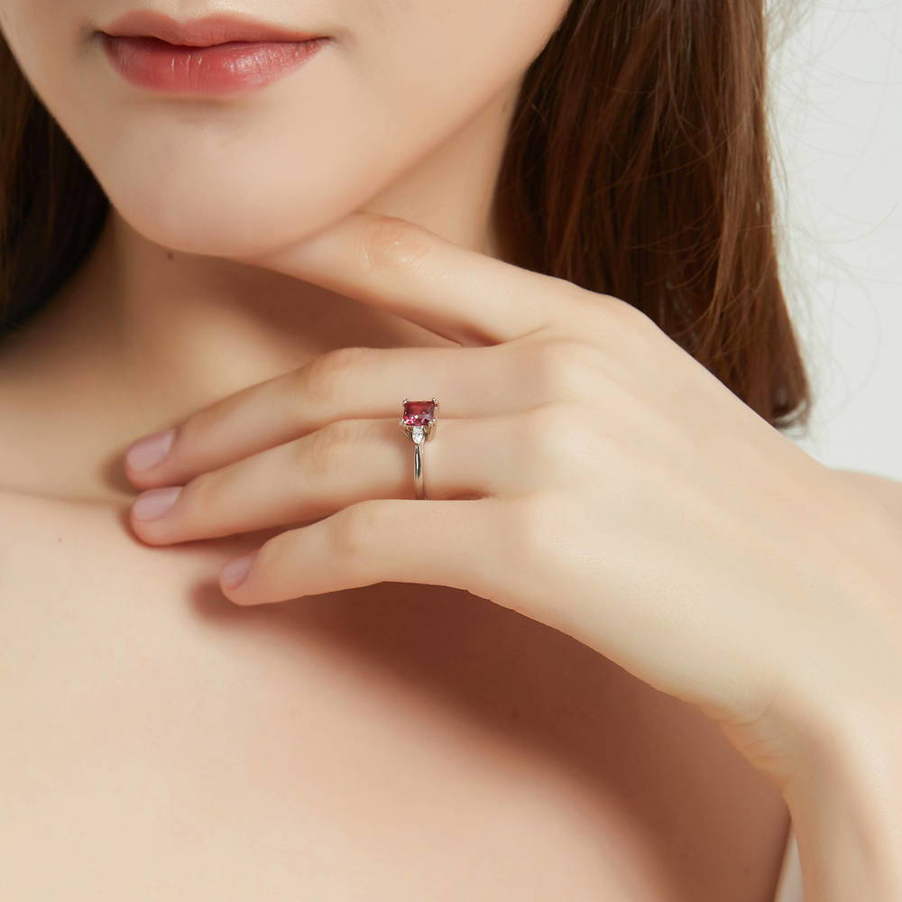 Model wearing 3-Stone Red Princess CZ Ring in Sterling Silver