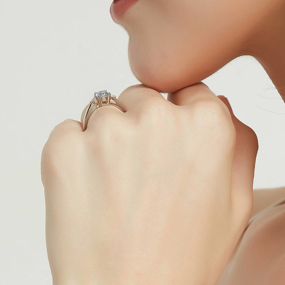Model wearing 3-Stone Greyish Blue Round CZ Ring in Sterling Silver, 7 of 9