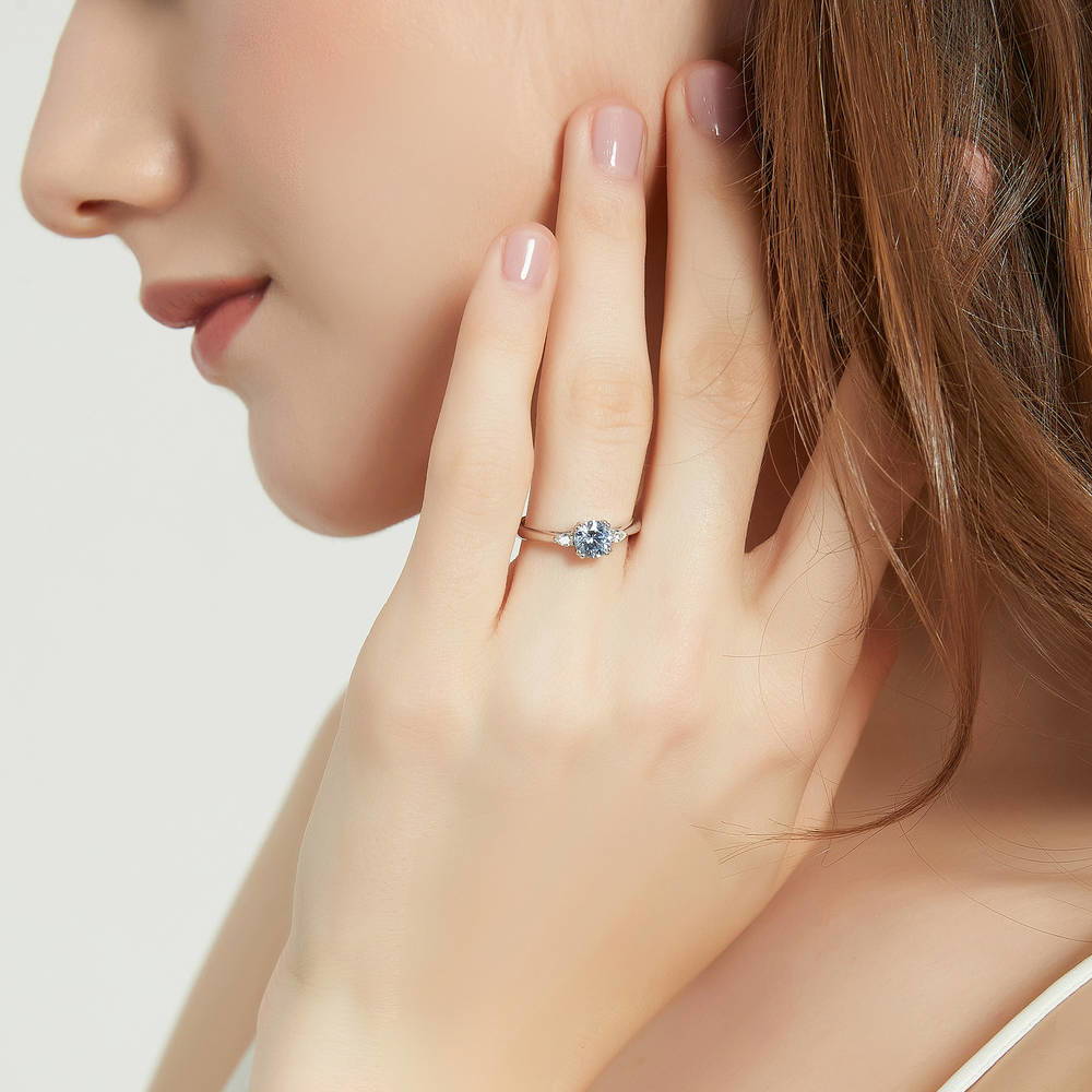 Model wearing 3-Stone Greyish Blue Round CZ Ring in Sterling Silver, 2 of 9