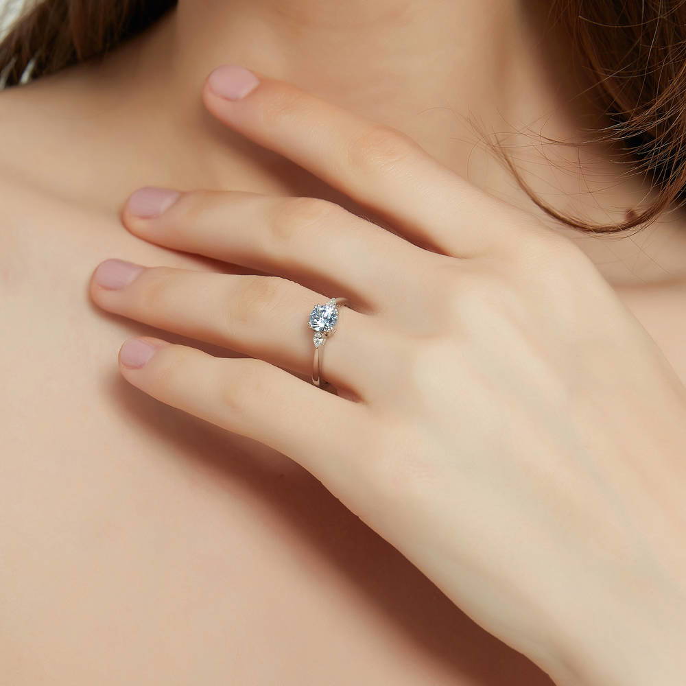 Model wearing 3-Stone Greyish Blue Round CZ Ring in Sterling Silver, 3 of 9