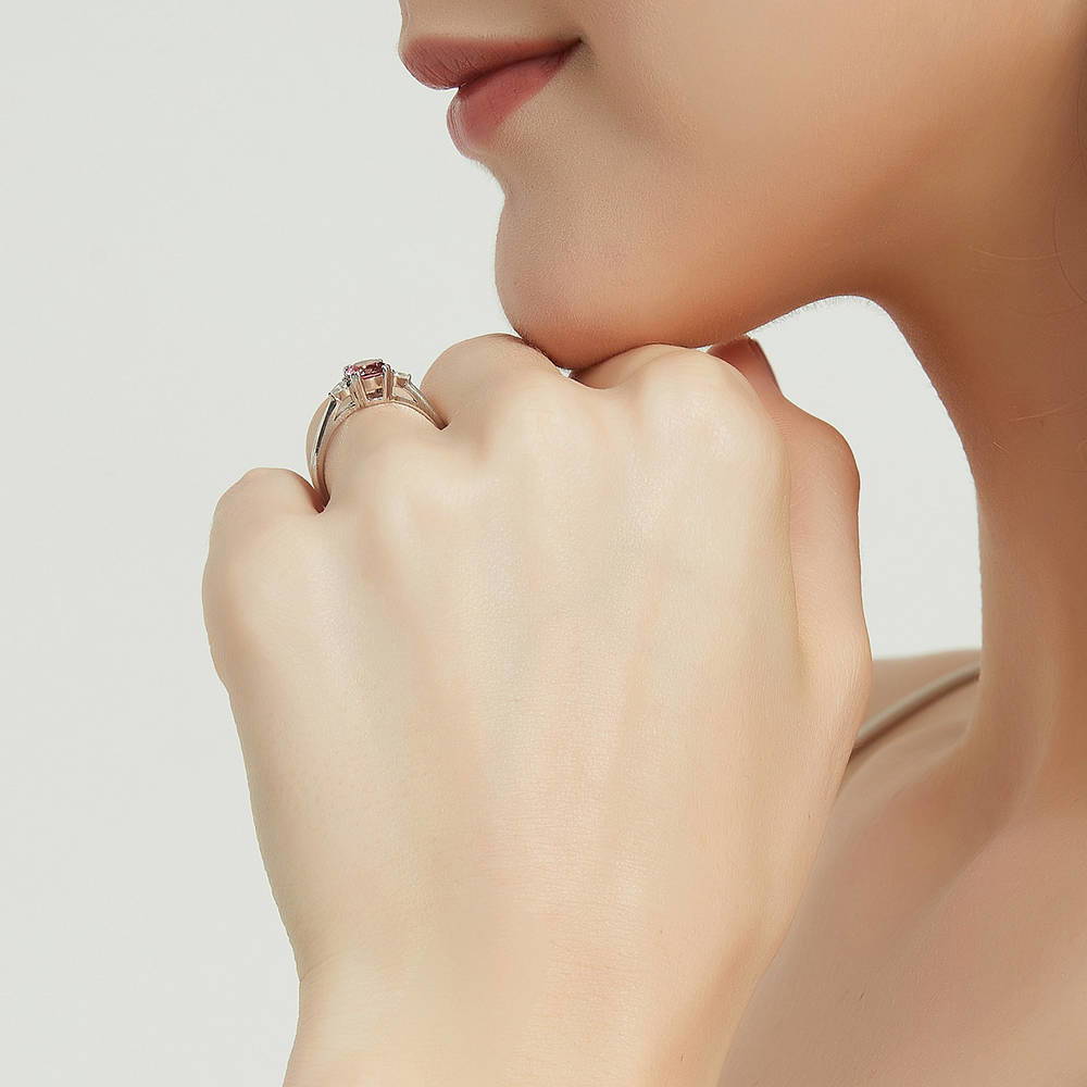 Model wearing 3-Stone Red Round CZ Ring in Sterling Silver