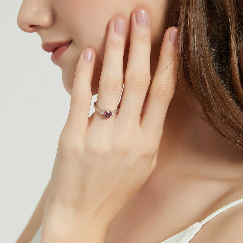 Model wearing 3-Stone Red Round CZ Ring in Sterling Silver