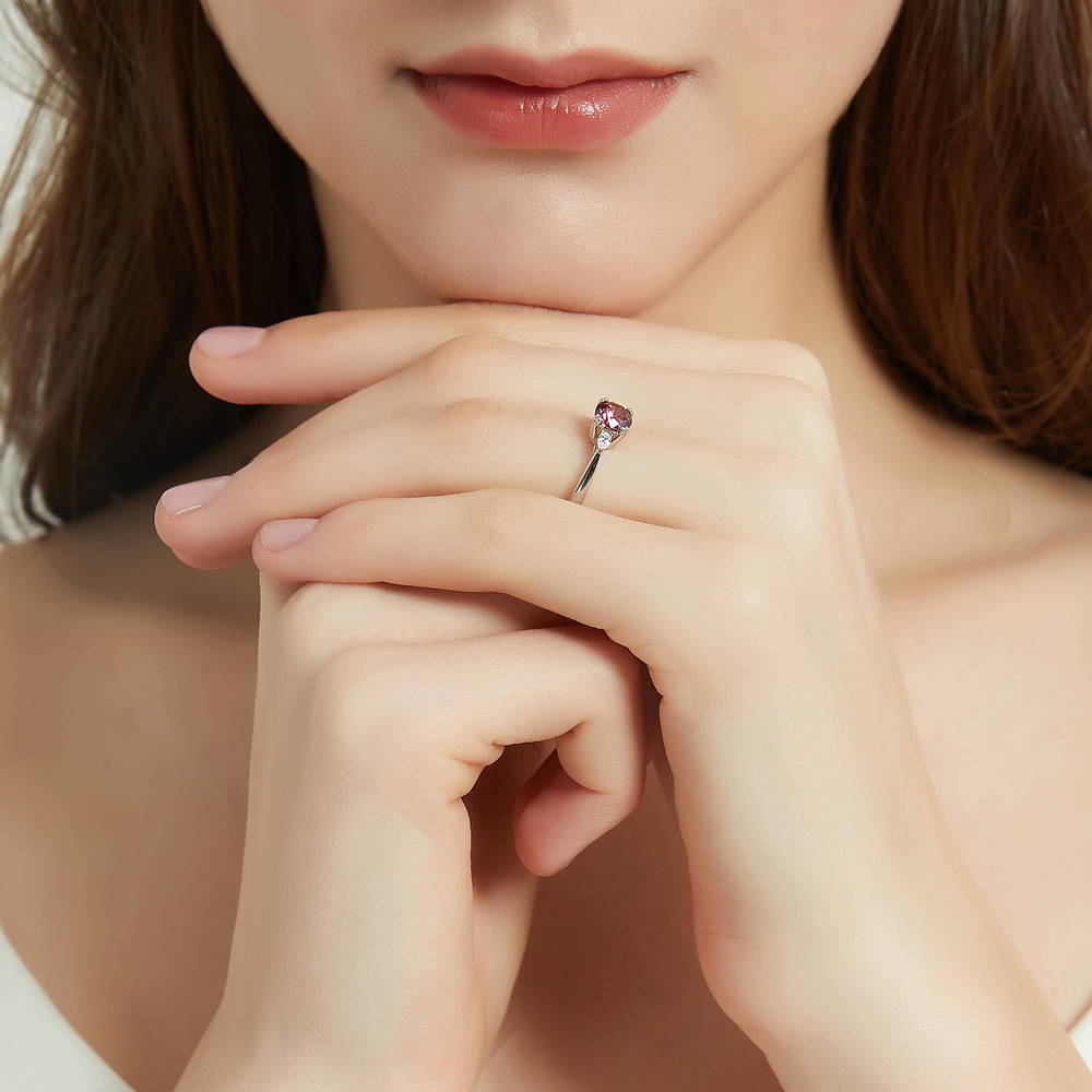 Model wearing 3-Stone Red Round CZ Ring in Sterling Silver