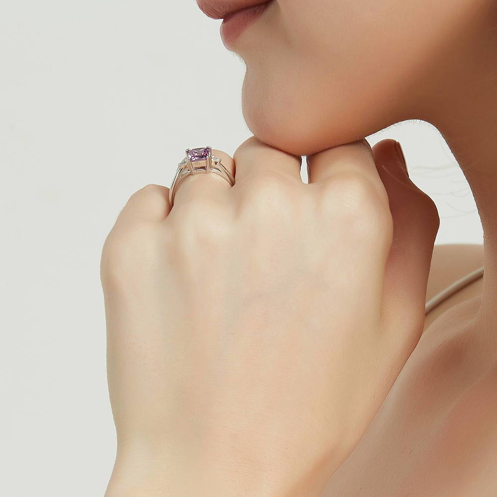 Model wearing 3-Stone Purple Princess CZ Ring in Sterling Silver