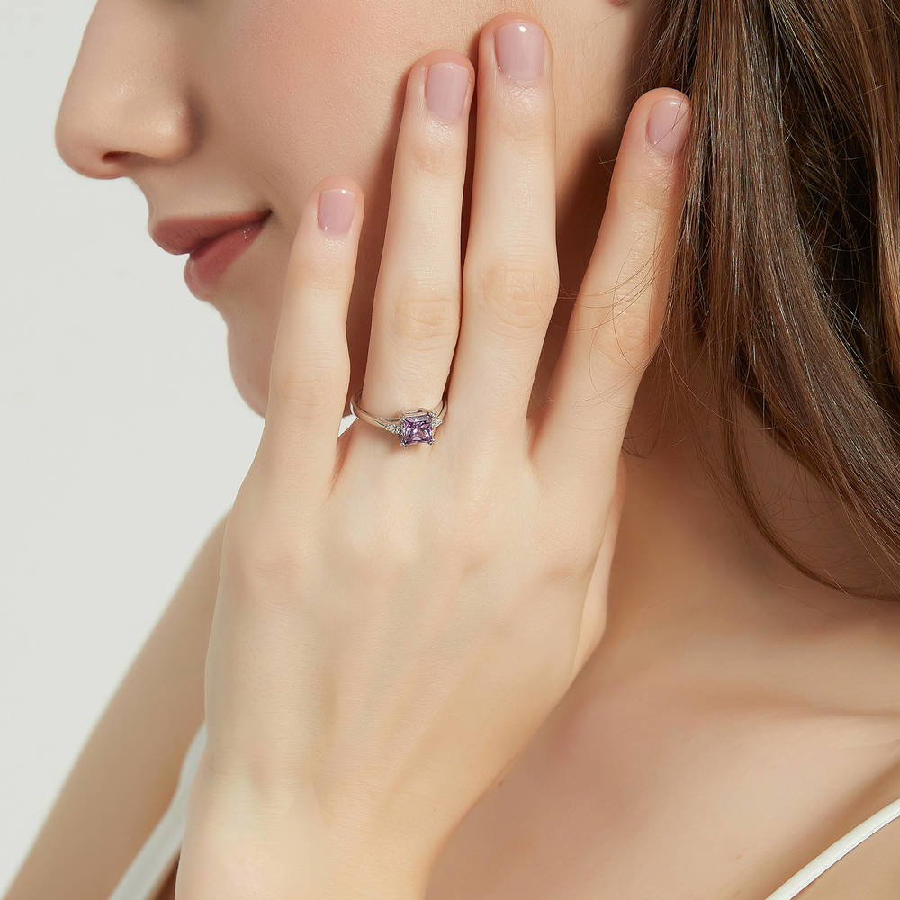 Model wearing 3-Stone Purple Princess CZ Ring in Sterling Silver