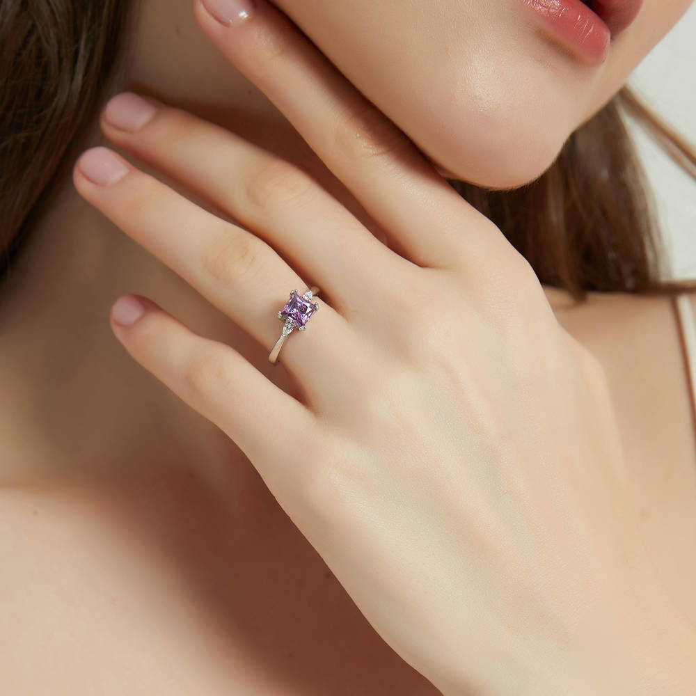 Model wearing 3-Stone Purple Princess CZ Ring in Sterling Silver