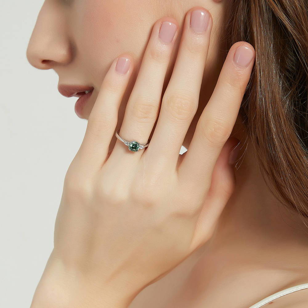 Model wearing 3-Stone Green Round CZ Ring in Sterling Silver