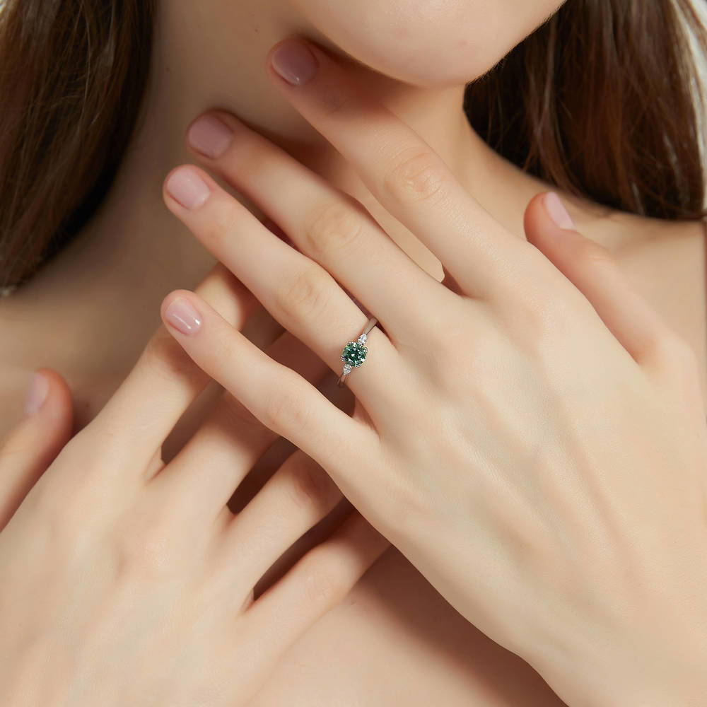 Model wearing 3-Stone Green Round CZ Ring in Sterling Silver