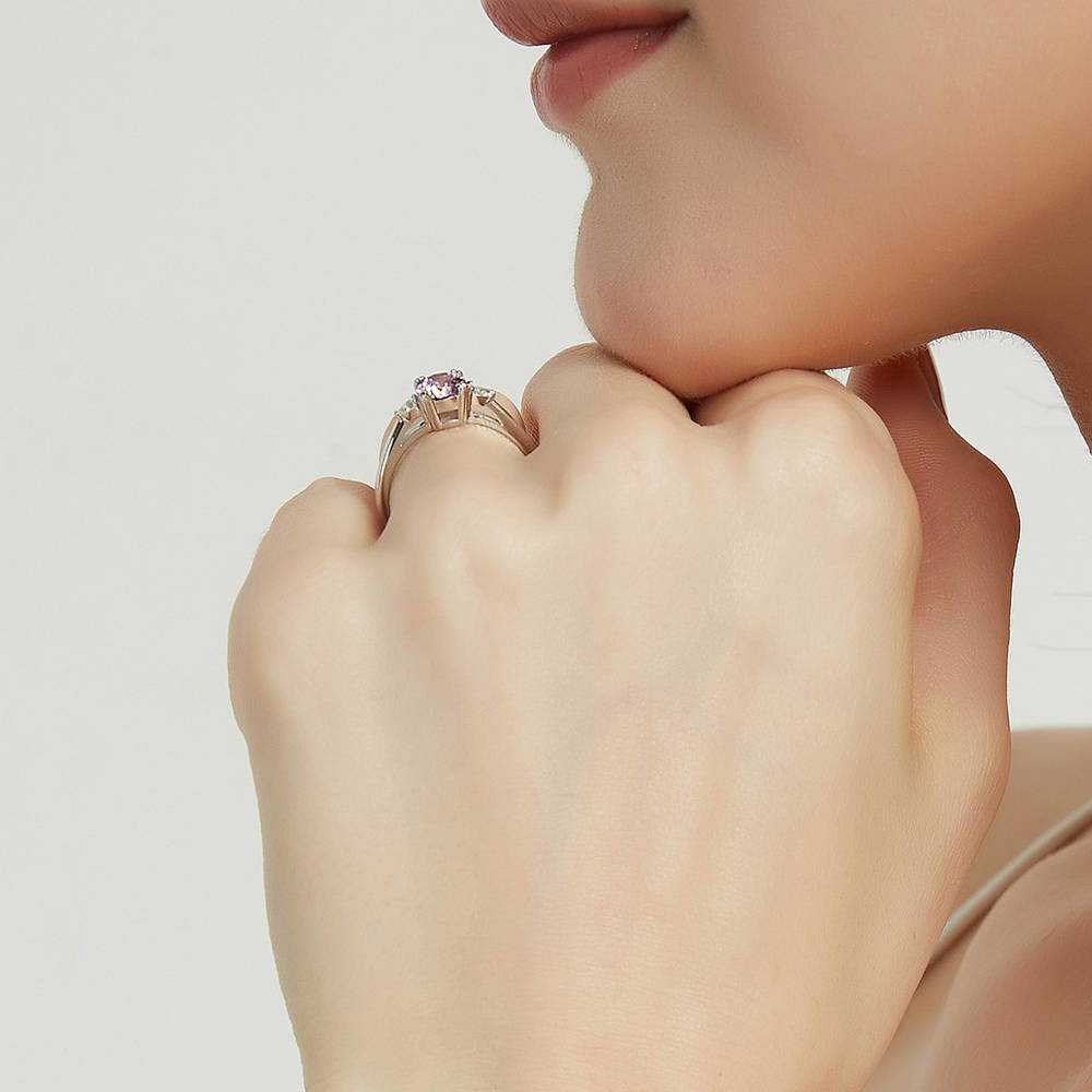 Model wearing 3-Stone Purple Round CZ Ring in Sterling Silver