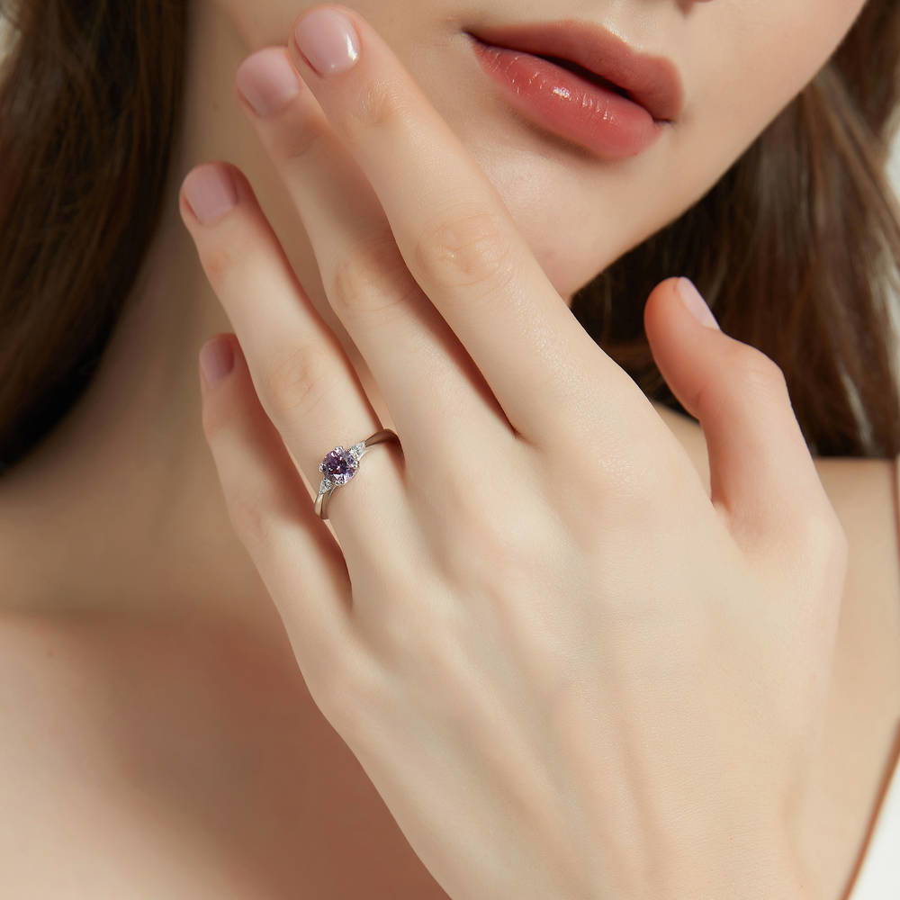 Model wearing 3-Stone Purple Round CZ Ring in Sterling Silver
