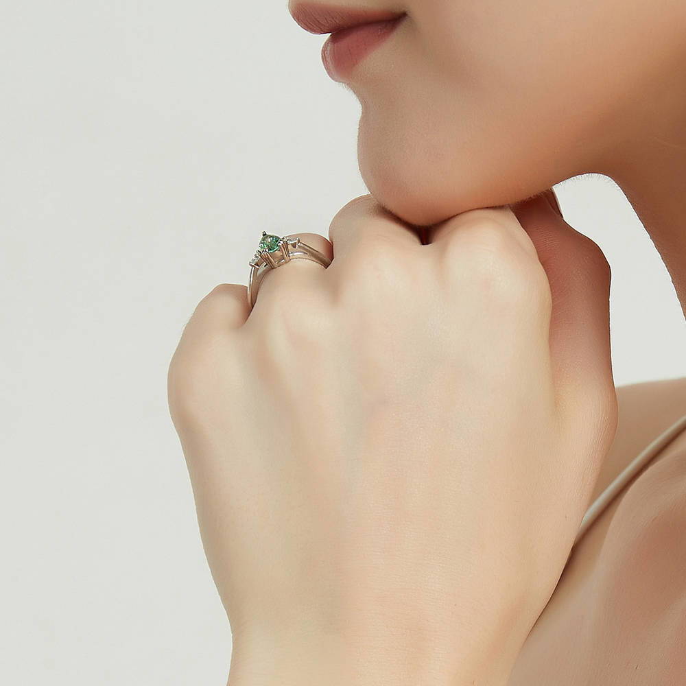 Model wearing 3-Stone Green Pear CZ Ring in Sterling Silver, 7 of 9