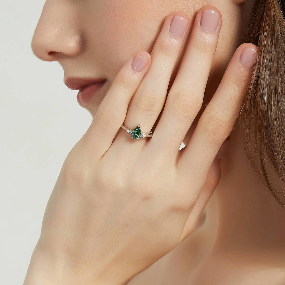Model wearing 3-Stone Green Pear CZ Ring in Sterling Silver, 2 of 9