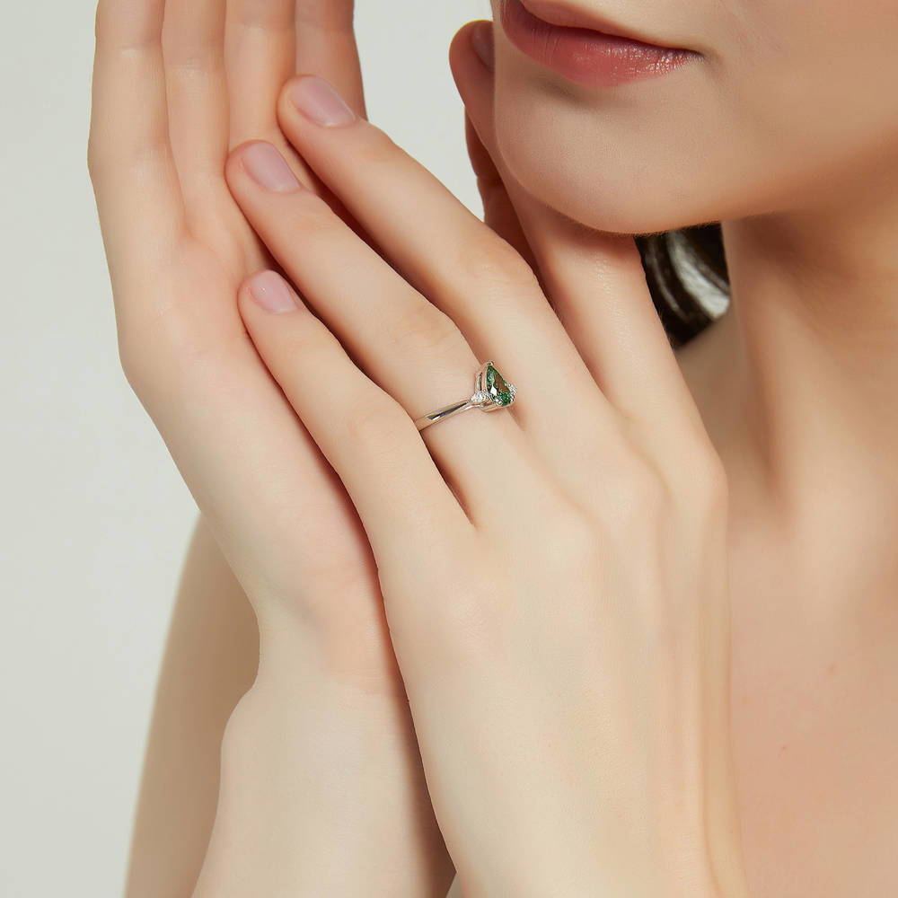 Model wearing 3-Stone Green Pear CZ Ring in Sterling Silver, 3 of 9