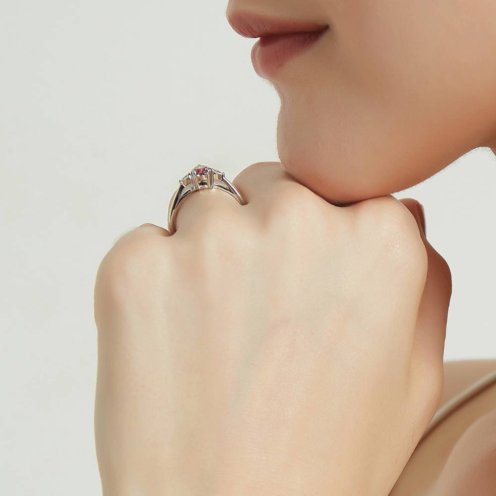 Model wearing 3-Stone Red Pear CZ Ring in Sterling Silver