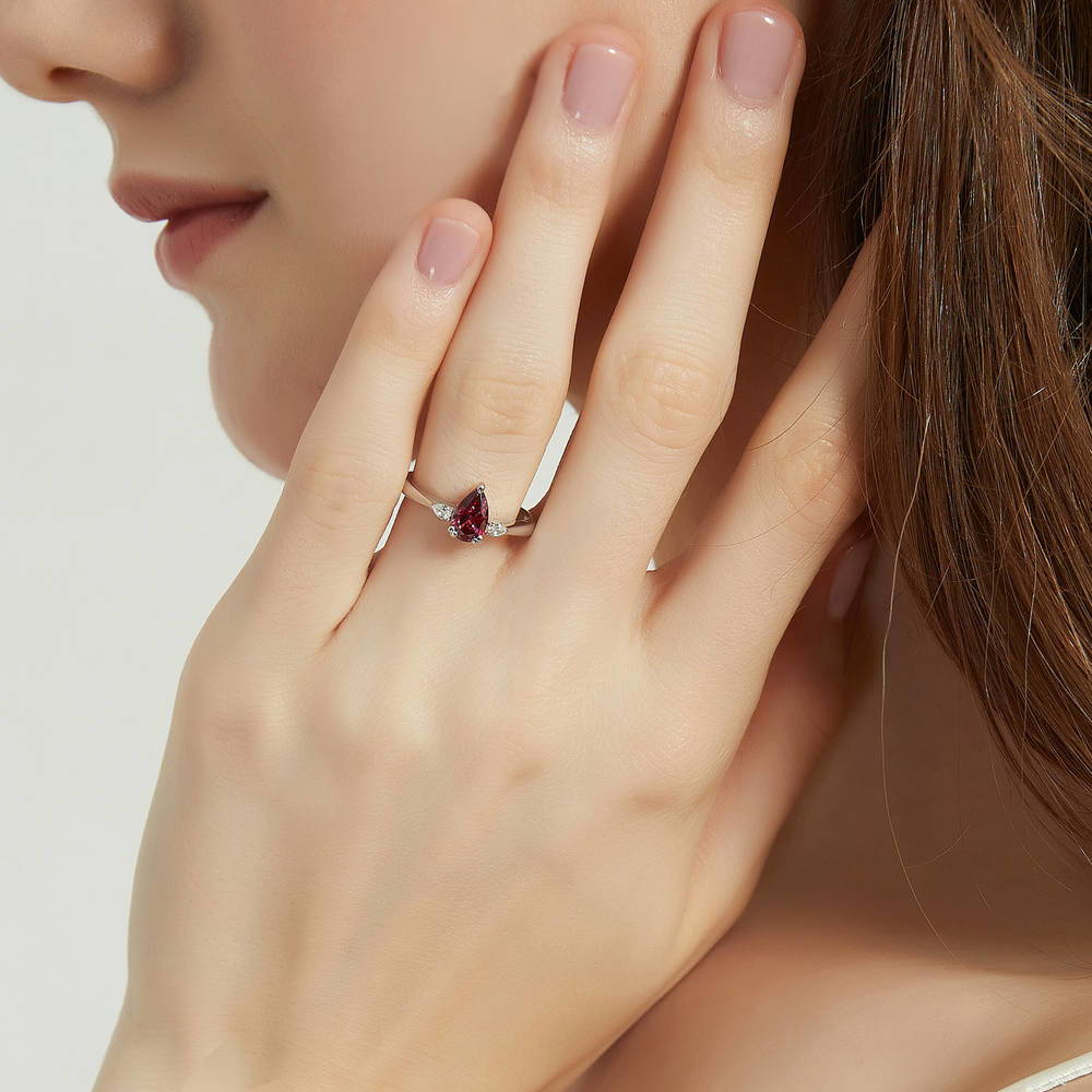 Model wearing 3-Stone Red Pear CZ Ring in Sterling Silver