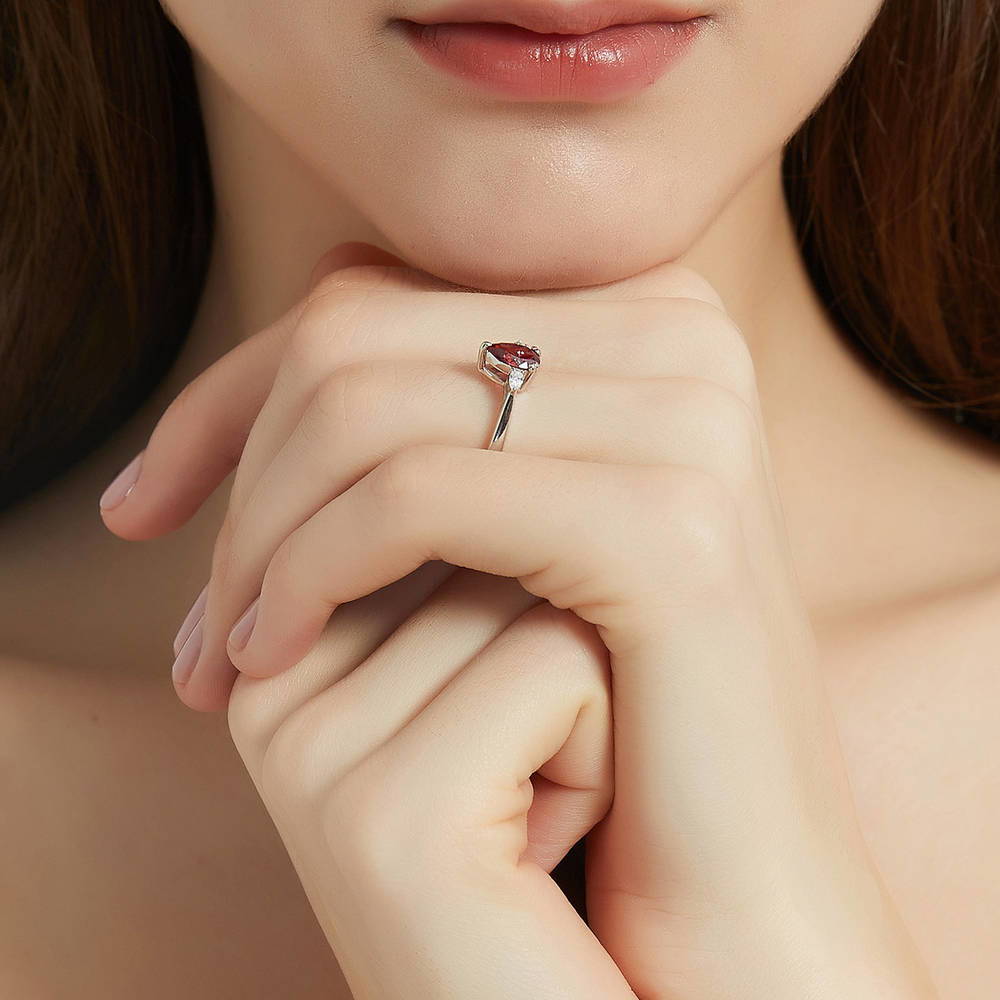 Model wearing 3-Stone Red Pear CZ Ring in Sterling Silver